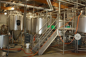 Large fermentation tanks in a brewery.