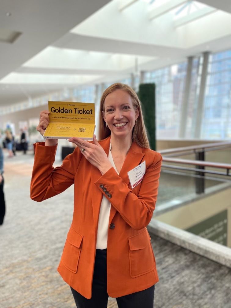 Our friend Emma, CEO of Paradox Consulting, showing off her Golden Ticket chocolate bar.